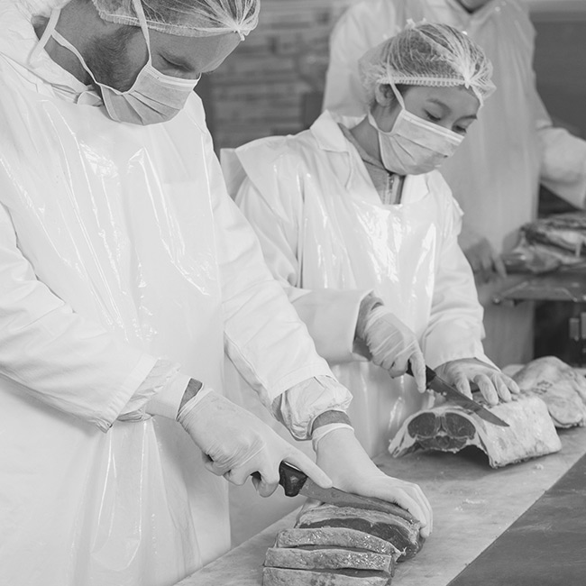 Workers at a meat factory